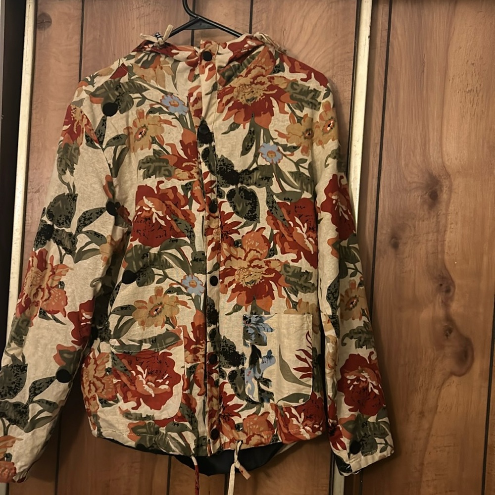 Light floral jacket. Women’s medium or men’s small.
